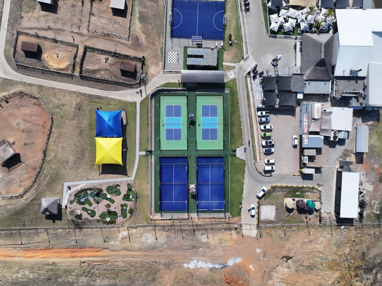 Top-down view of the blue and green courts